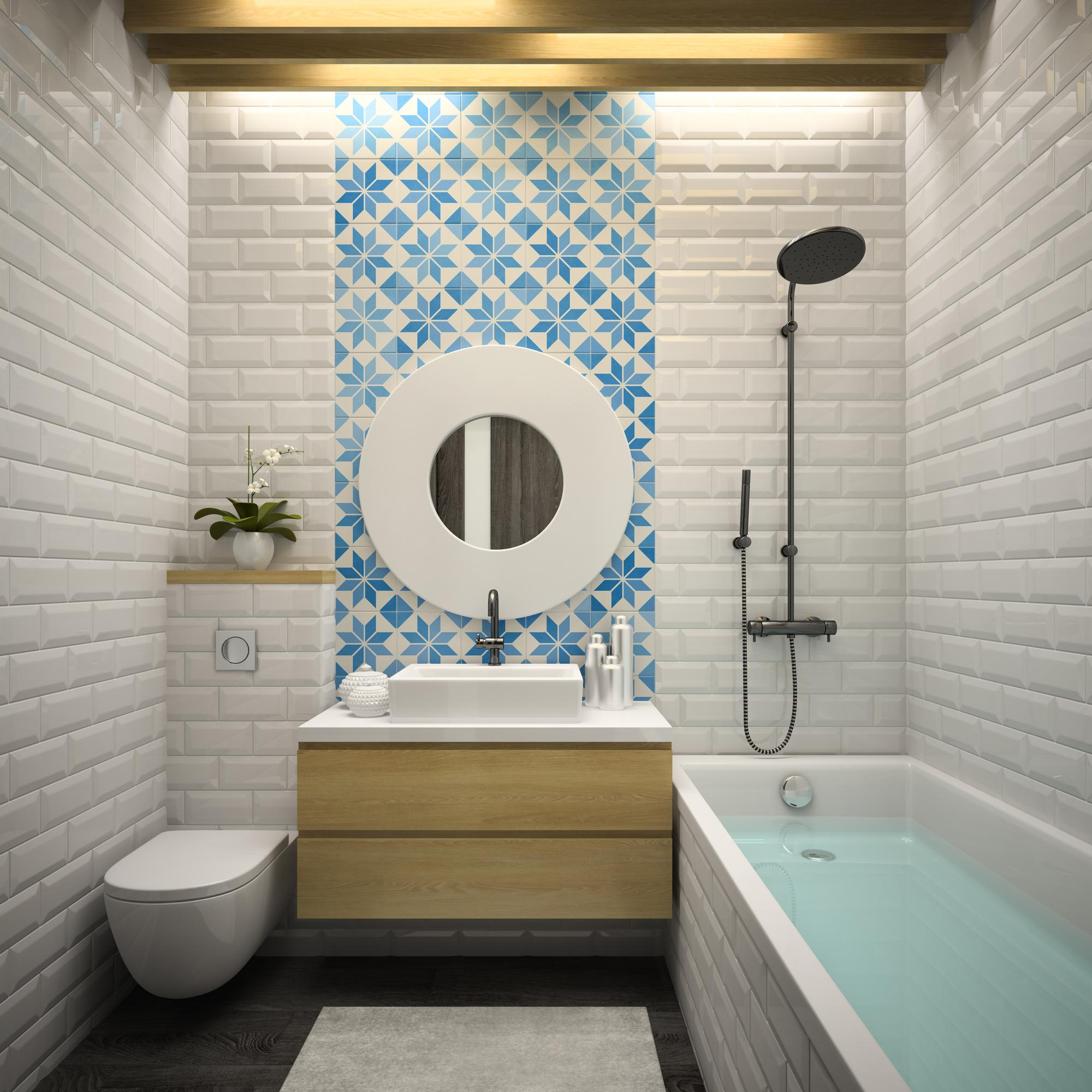 Professional applying sealant on marble shower wall in Dallas home