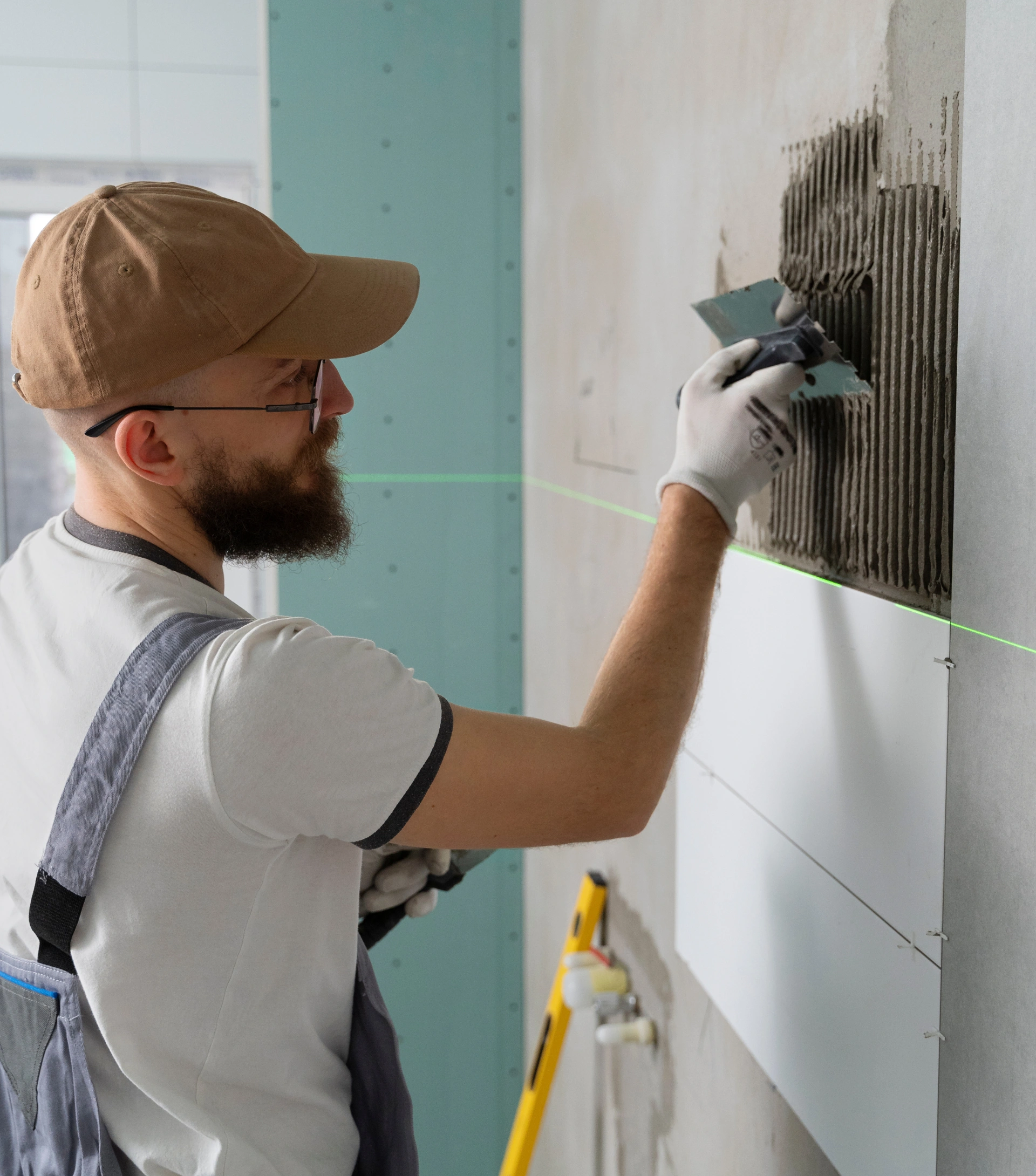 Professional tile installer working on bathroom renovation in Dallas